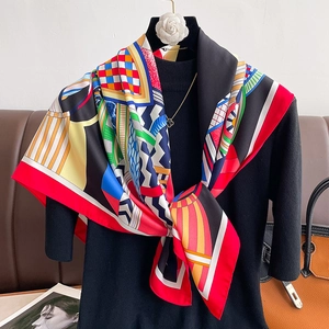 Colorful geometric abstract print silk square scarf styled on a black mannequin