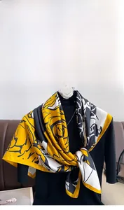 Close-up of floral twill silk scarf showing smooth texture and elegant flower pattern