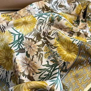 Elegant mulberry silk scarf with yellow daisy floral print and geometric border
