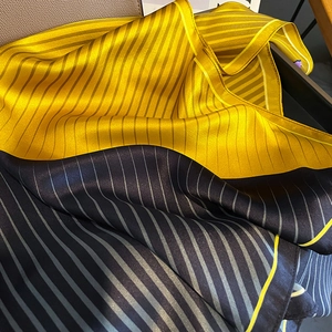 Elegant 100% mulberry silk scarf featuring bold blue and yellow stripes with fine edges