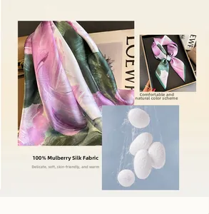Detail of 100% mulberry silk scarf featuring floral pattern and soft texture