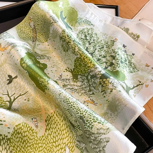 53cm silk scarf with green forest print of trees and wildlife in a gift box