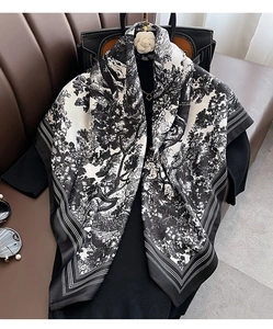 Detailed view of vintage landscape print silk scarf with classic black and white striped border