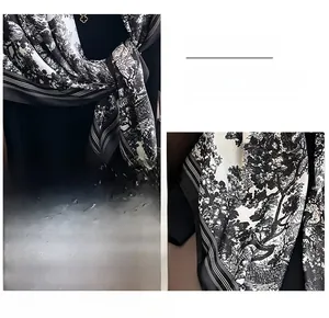 Detail of silk scarf showing nature landscape print and precision stitched edges