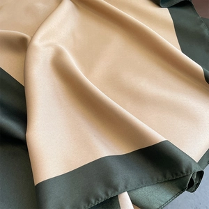 Contrast satin silk scarf in champagne and dark green with a soft glossy finish
