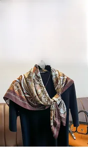 Detail of vintage pattern silk scarf draped over a black suit with high-end texture