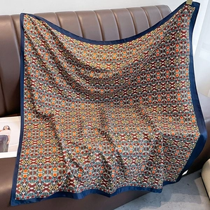 Floral twill silk square scarf with colorful bohemian patterns and navy blue borders