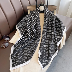 Classic black and white houndstooth square silk scarf styled with luxury accessories