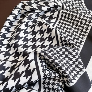 Elegant black and white houndstooth silk scarf with satin finish and classic French style