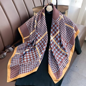 Red and blue houndstooth silk scarf with yellow borders and Modern Fashion text