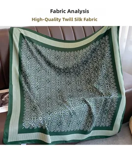 Detailed view of dark green twill silk scarf with vintage monogram pattern on leather