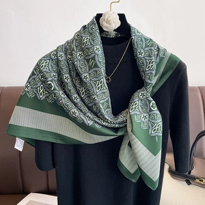 Vintage green and grey silk square scarf with 1854 floral jacquard pattern on a mannequin