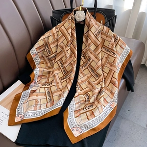 French style silk scarf with geometric patterns and stars on a leather background