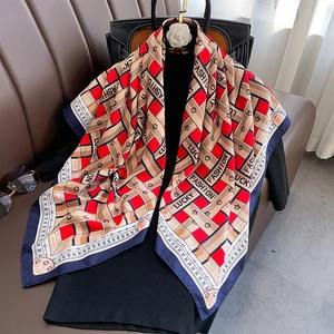 Detail of silk-like scarf featuring geometric grid patterns and fashion letter prints