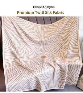 Macro shot of high-quality twill silk large square scarf showing beige and gold texture