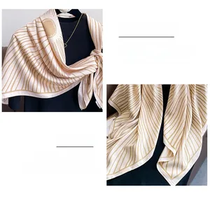 Detail of satin twill square scarf showing fine stitching and champagne silk texture