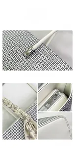 Close-up of white embossed leather tote with monogram texture and silk scarf handle