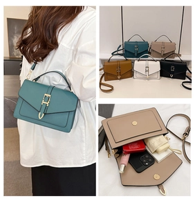 Detailed interior storage showing essentials and flap closure with golden buckle