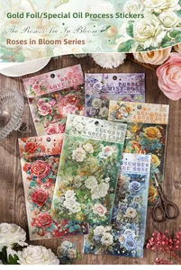 Macro shot of rose gold-stamped PET stickers with elegant floral motifs for scrapbooking