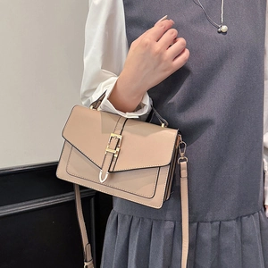 Chic beige retro crossbody bag with gold buckle and adjustable strap for women