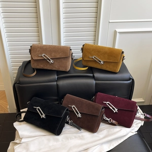 Minimalist square crossbody bags in five colors with unique paperclip metal lock