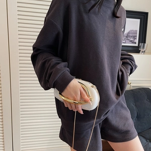 Classic dark grey waffle knit loungewear set with a stylish round metal handle clutch bag