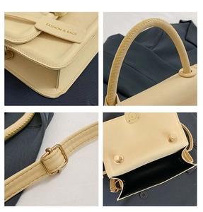 Detail view of cream crossbody bag featuring yellow contrast stitching and magnetic closure