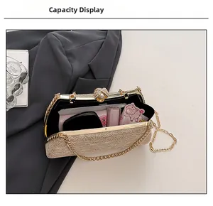 Internal view of champagne clutch bag showing space for lipstick and makeup items