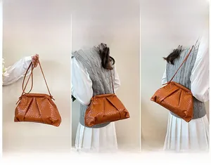 Detailed views of the brown woven texture and soft pleated design of this crossbody bag