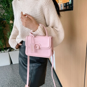 Pink PU leather small square handbag with rounded handle and matching shoulder strap
