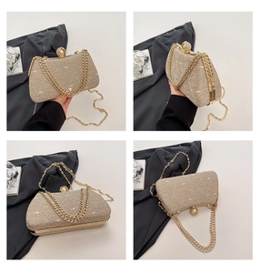 Detail view of champagne gold evening clutch featuring lace texture and pearl clasp