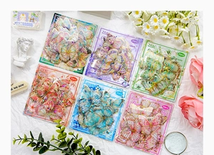Close-up of butterfly PET stickers with laser gold stamping for DIY scrapbook journals