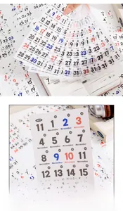 Macro detail of transparent calendar stickers with colorful dates for journal planning