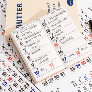Aesthetic pocket weekly planner with warm cream pages and structured daily layout