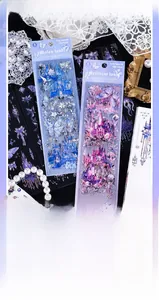 Macro shot of laser holographic silver stickers featuring dreamy blue castles and butterflies