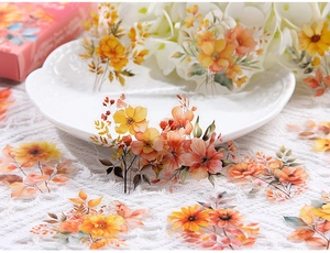 Macro detail of PET floral stickers with transparent edges on a vintage lace background