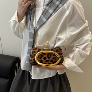 Fashionable leopard print box clutch with gold C-handle and metal chain strap