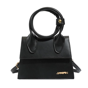 Minimalist black PU leather handbag with oversized round handle and gold metal logo