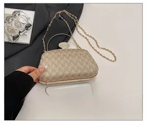 Champagne glitter evening clutch bag with crystal lock and phone size reference