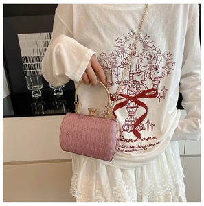 Pink glitter chain evening clutch bag with gold round handle and detachable shoulder strap