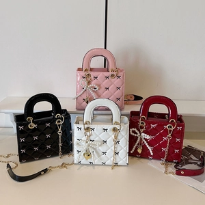 Glossy patent leather quilted handbags in four colors with chain straps and bow charms