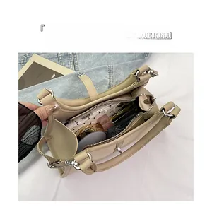 Interior view showing large capacity storage and organized compartments of the apricot handbag