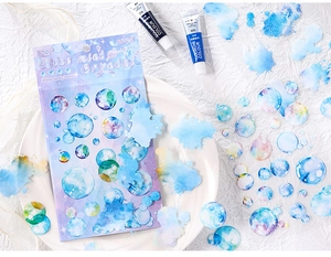 Macro detail of Blue Mist Crystal PET stickers showing artistic watercolor bubble designs