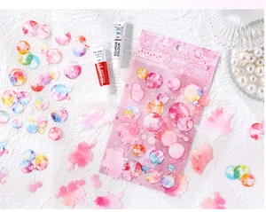 Macro shot of 4PCS dreamy watercolor PET stickers on artistic white textured background