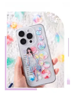 Close-up of clear iPhone case featuring 3D cartoon girl and colorful bubble stickers