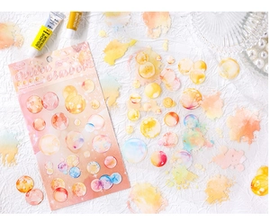 Macro shot of 6pcs Golden Amber PET stickers with watercolor bubbles for journaling