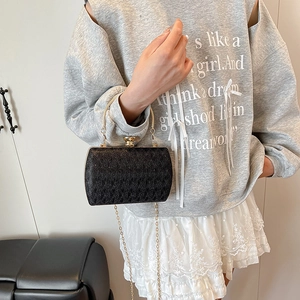 Elegant black evening clutch with gold chain strap and textured finish for women