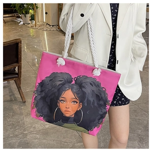 Detail of pink canvas tote bag with anime girl print and thick cotton rope handles
