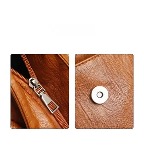 Detail of high-quality brown leather texture with durable zipper and magnetic buckle closure