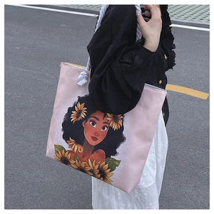 Detailed side view of pink canvas tote bag with artistic print and thick rope handles